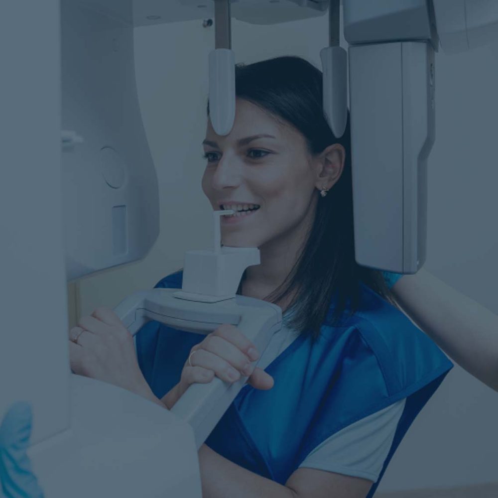 A patient positioned for a CBCT scan